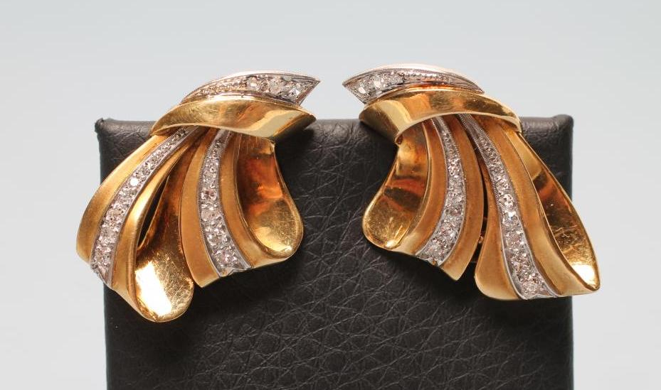 A PAIR OF 1940'S STYLE DIAMOND CLIP EARRINGS of stylised loops centred by pave set bands Image