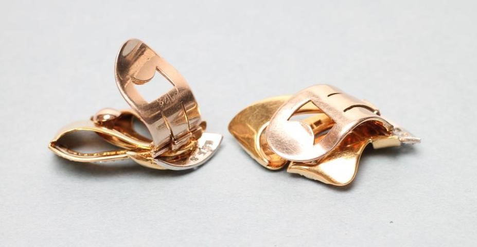 A PAIR OF 1940'S STYLE DIAMOND CLIP EARRINGS of stylised loops centred by pave set bands Image