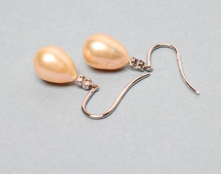 A PAIR OF PEARL AND DIAMOND DROP EARRINGS Image