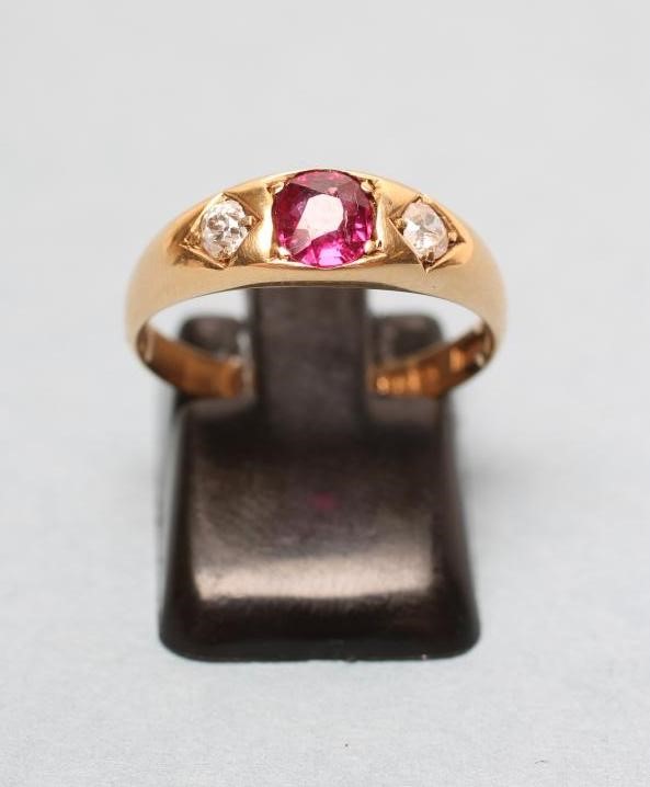 AN EDWARDIAN THREE STONE RUBY AND DIAMOND RING Image