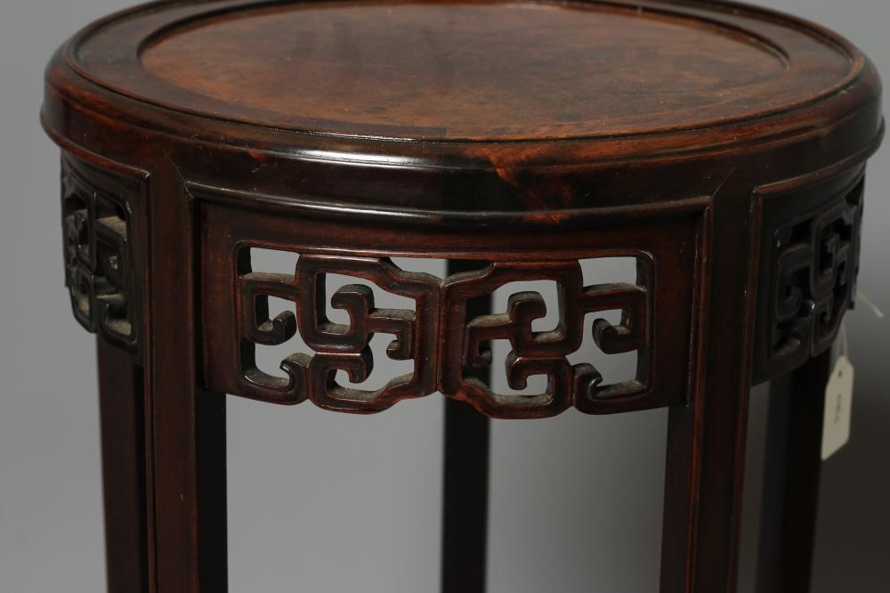 AN ORIENTAL HARDWOOD JARDINIERE STAND Image