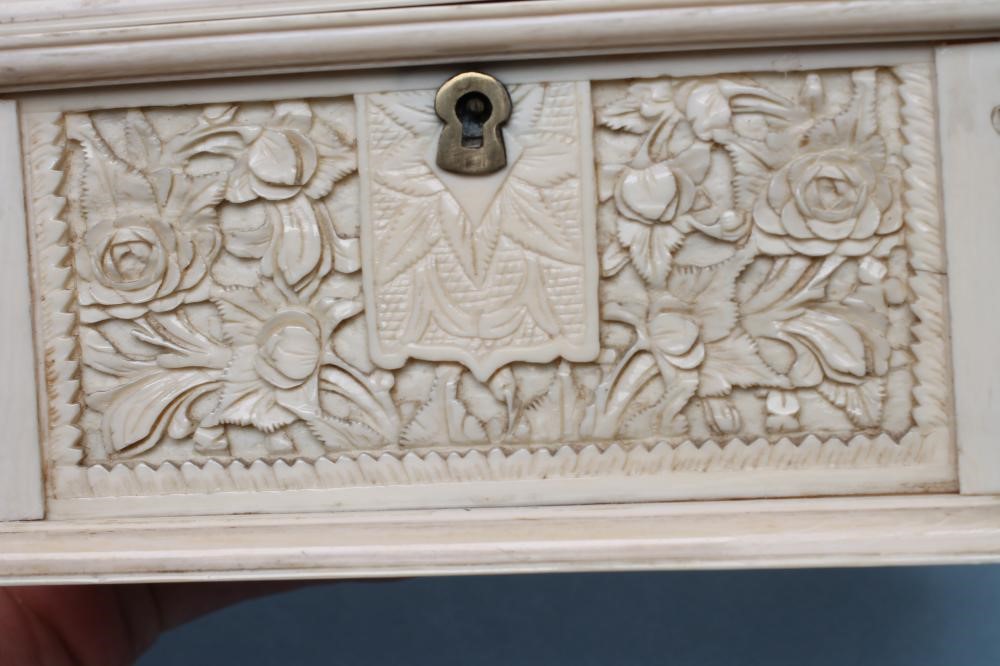 AN IVORY CASKET of plain oblong form Image