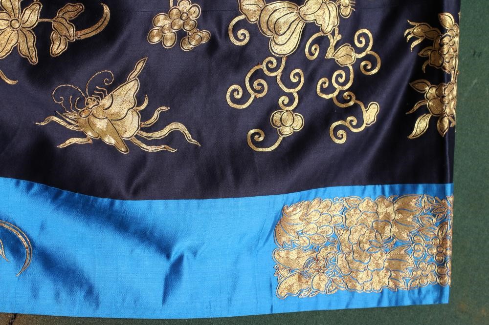 A CHINESE BLACK SILK COAT Image