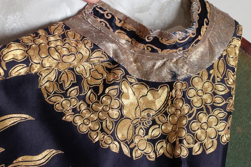 A CHINESE BLACK SILK COAT Image