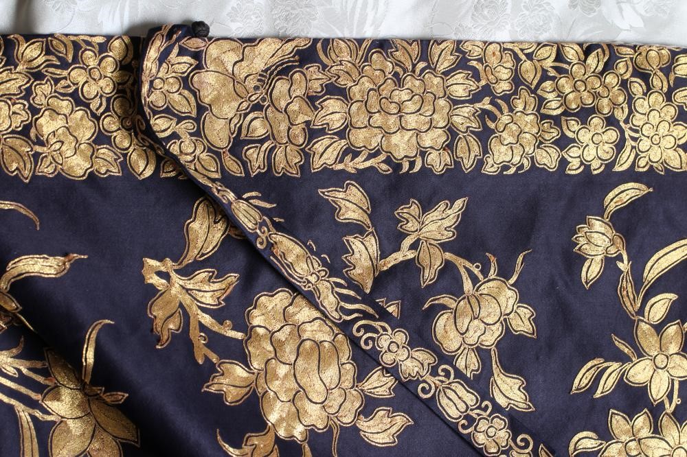 A CHINESE BLACK SILK COAT Image