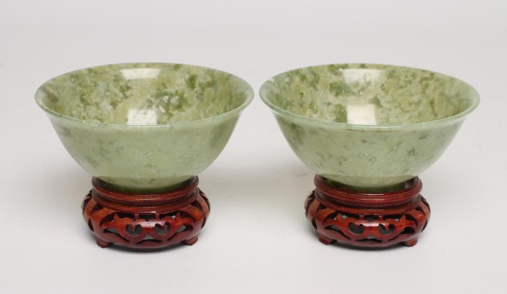 A PAIR OF TURNED AND POLISHED JADE BOWLS of plain circular form Image