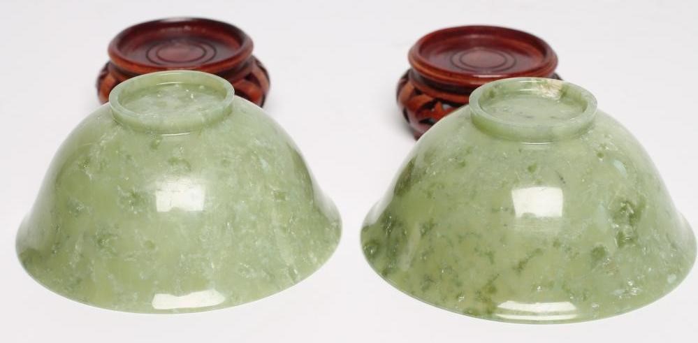 A PAIR OF TURNED AND POLISHED JADE BOWLS of plain circular form Image