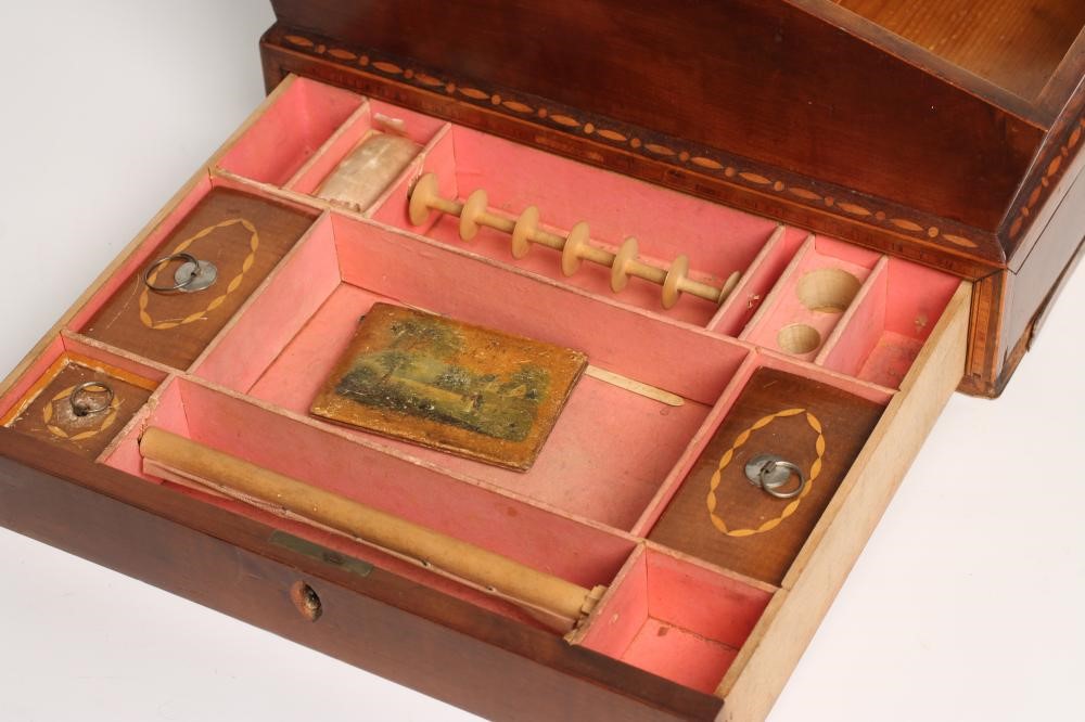 A REGENCY MAHOGANY AND CROSSBANDED WORKBOX Image