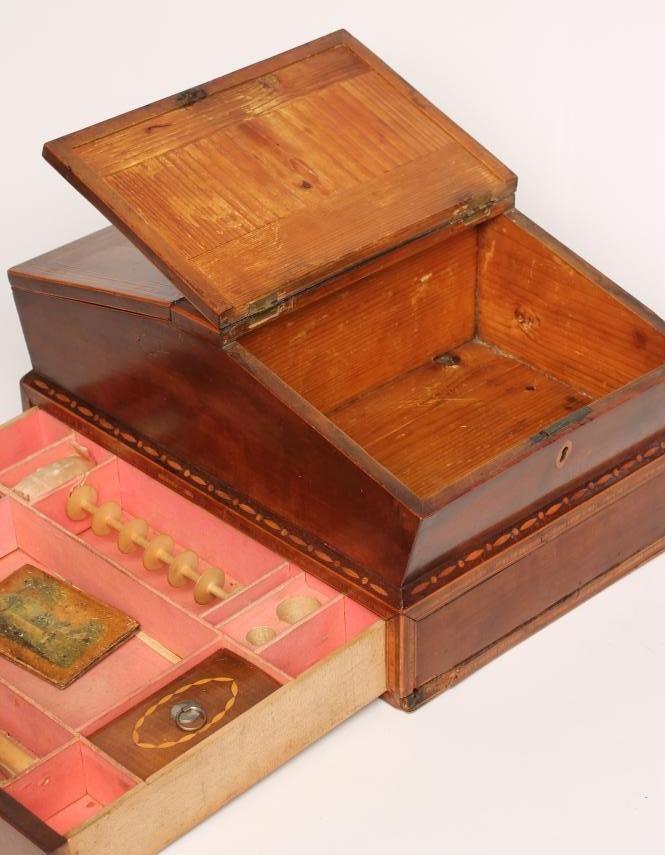 A REGENCY MAHOGANY AND CROSSBANDED WORKBOX Image