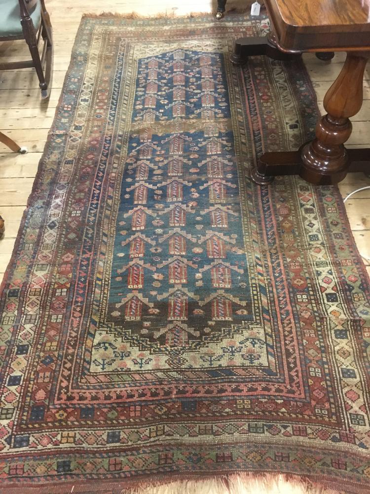 A PERSIAN TRIBAL RUG Image