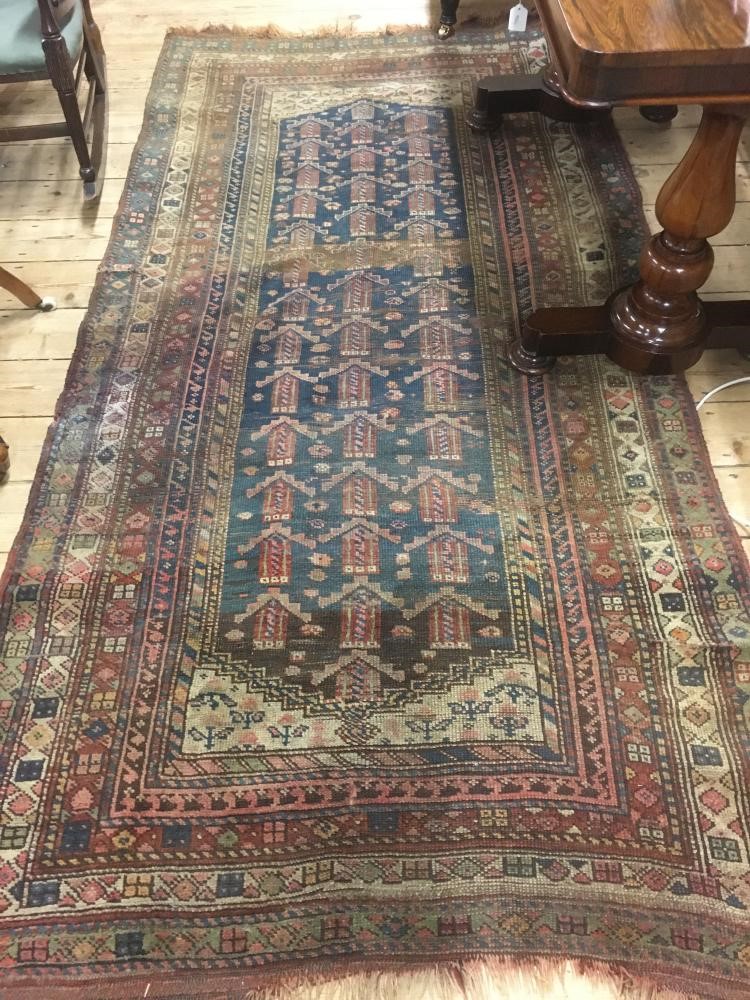 A PERSIAN TRIBAL RUG Image