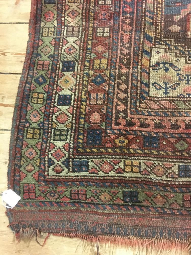 A PERSIAN TRIBAL RUG Image