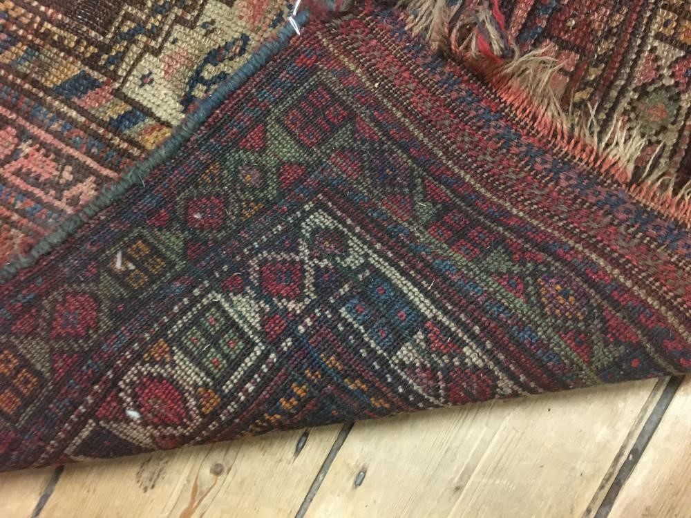 A PERSIAN TRIBAL RUG Image