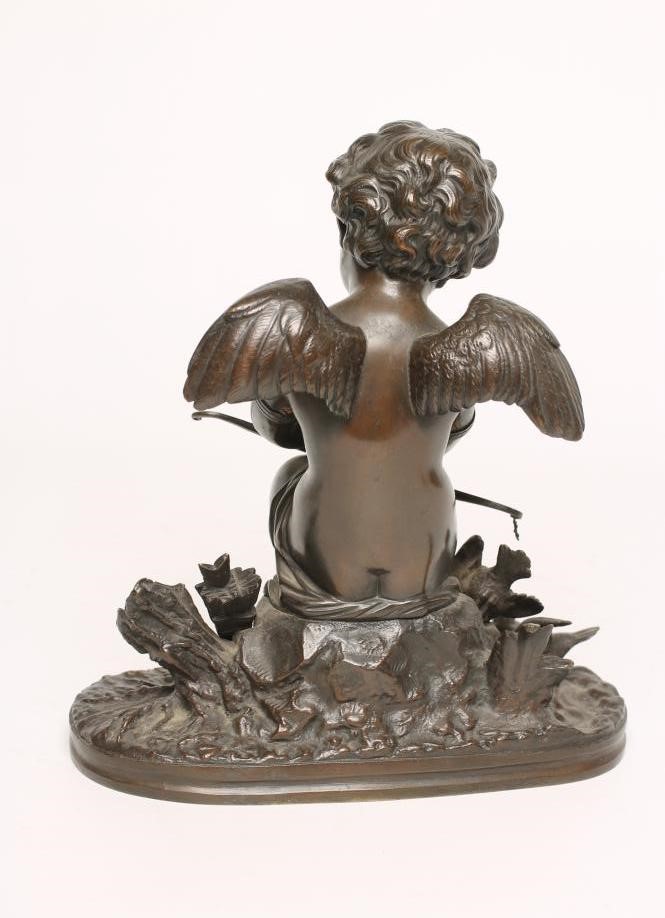 A BRONZE FIGURE OF CUPID Image