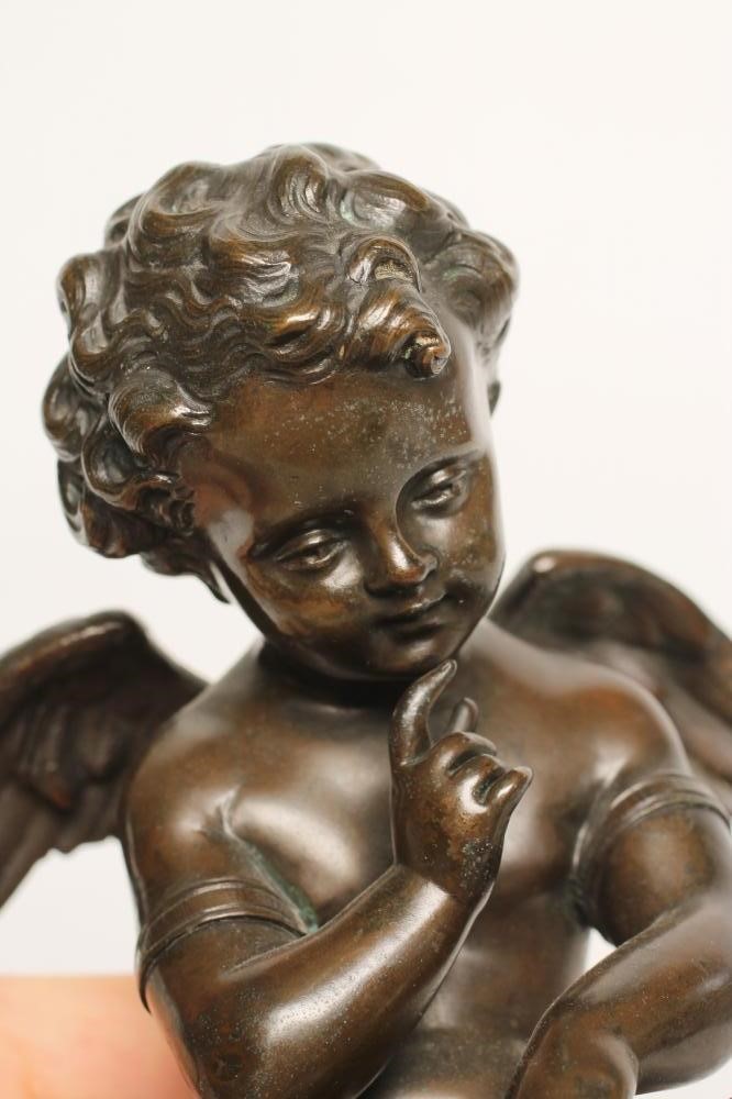 A BRONZE FIGURE OF CUPID Image
