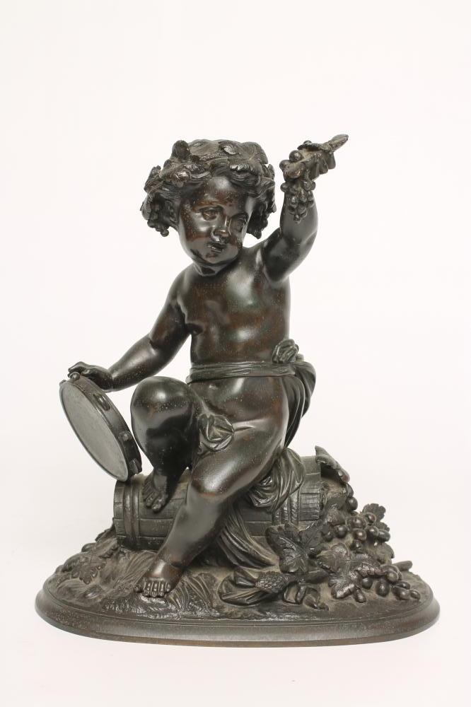A BRONZE FIGURE OF A BACCHANTE seated on a hod of grapes Image