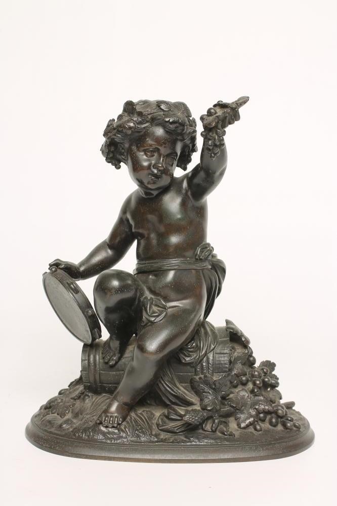 A BRONZE FIGURE OF A BACCHANTE seated on a hod of grapes Image