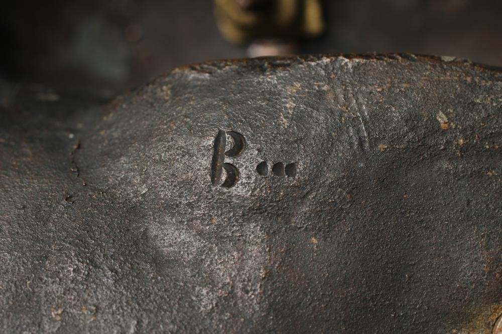 A BRONZE FIGURE OF A BACCHANTE seated on a hod of grapes Image