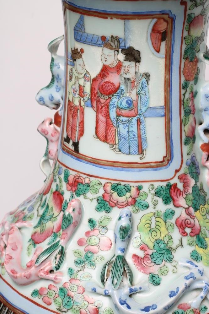 A CANTONESE PORCELAIN VASE of rounded cylindrical form with chi-long handles and everted rim Image