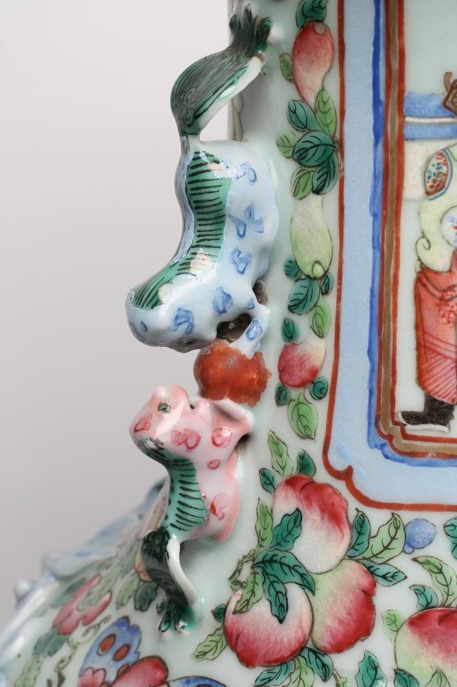 A CANTONESE PORCELAIN VASE of rounded cylindrical form with chi-long handles and everted rim Image