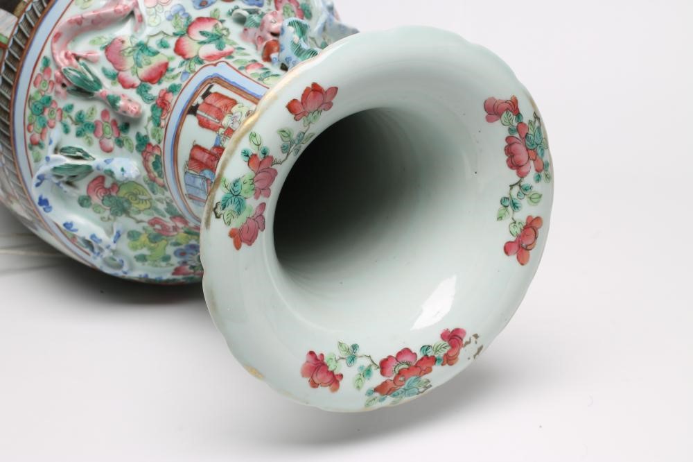 A CANTONESE PORCELAIN VASE of rounded cylindrical form with chi-long handles and everted rim Image