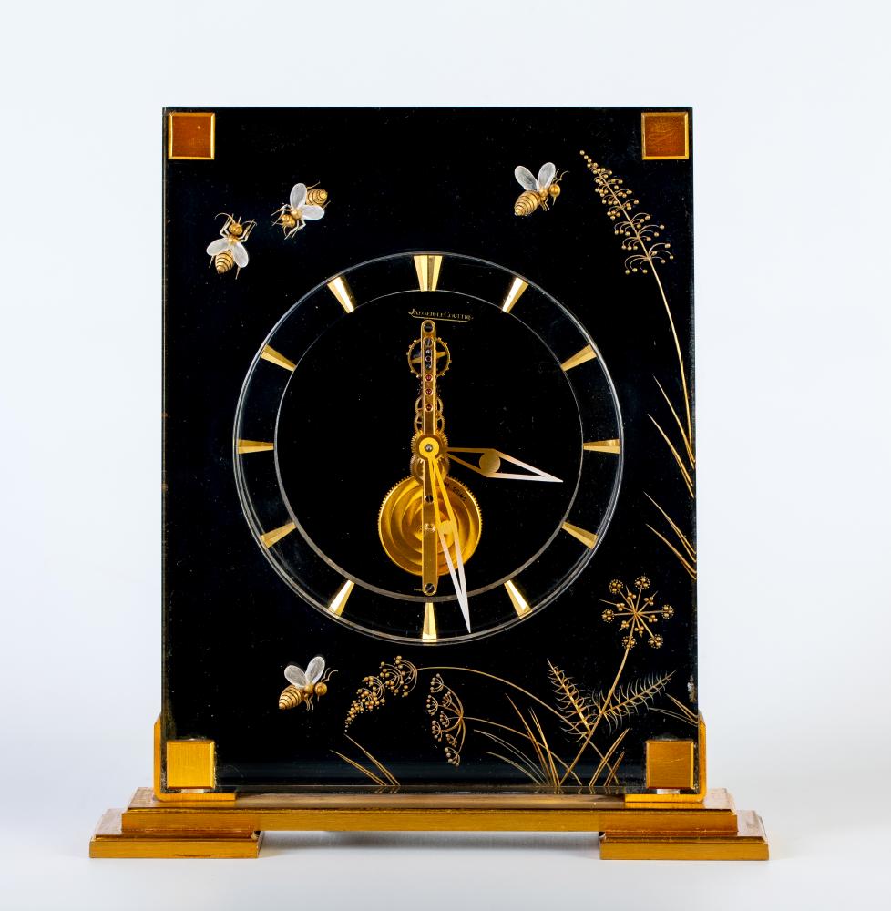A JAEGER LECOULTRE GILT METAL AND PERSPEX MYSTERY TIMEPIECE Image