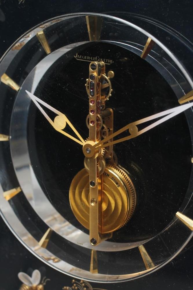 A JAEGER LECOULTRE GILT METAL AND PERSPEX MYSTERY TIMEPIECE Image