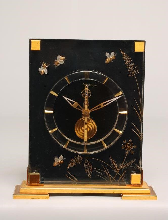 A JAEGER LECOULTRE GILT METAL AND PERSPEX MYSTERY TIMEPIECE Image