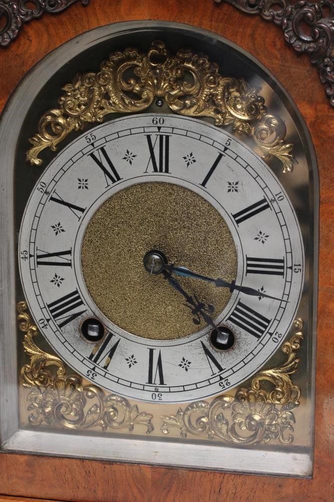 A WALNUT CASED TABLE CLOCK by Lenzkirch Image