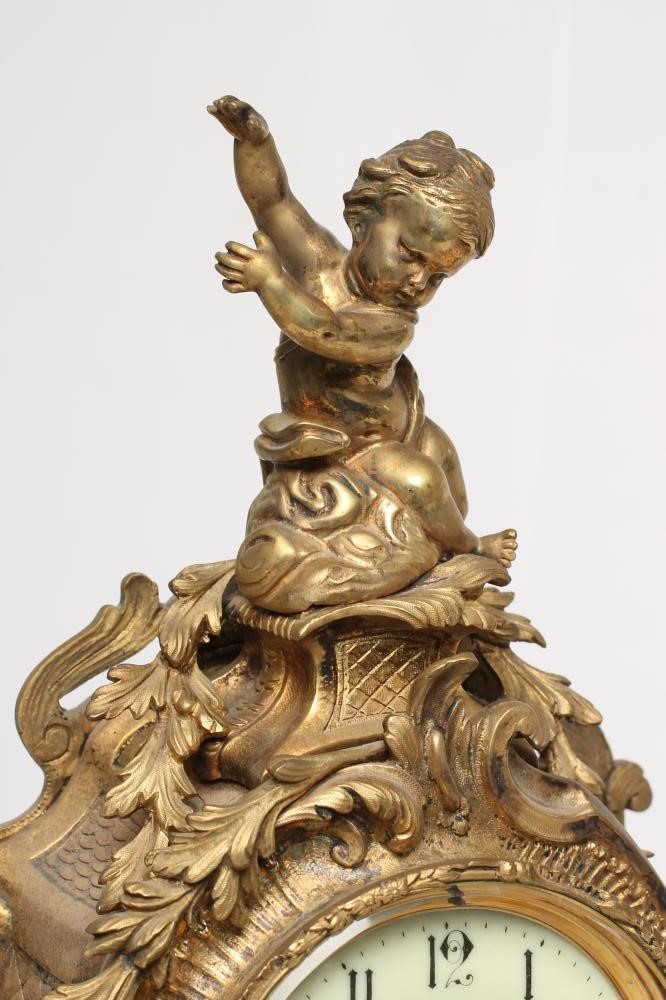 A FRENCH LOUIS XV STYLE ORMOLU AND CHAMPLEVE ENAMEL MANTEL CLOCK Image