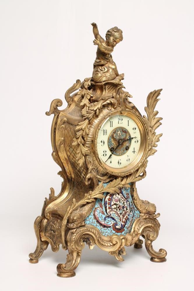 A FRENCH LOUIS XV STYLE ORMOLU AND CHAMPLEVE ENAMEL MANTEL CLOCK Image