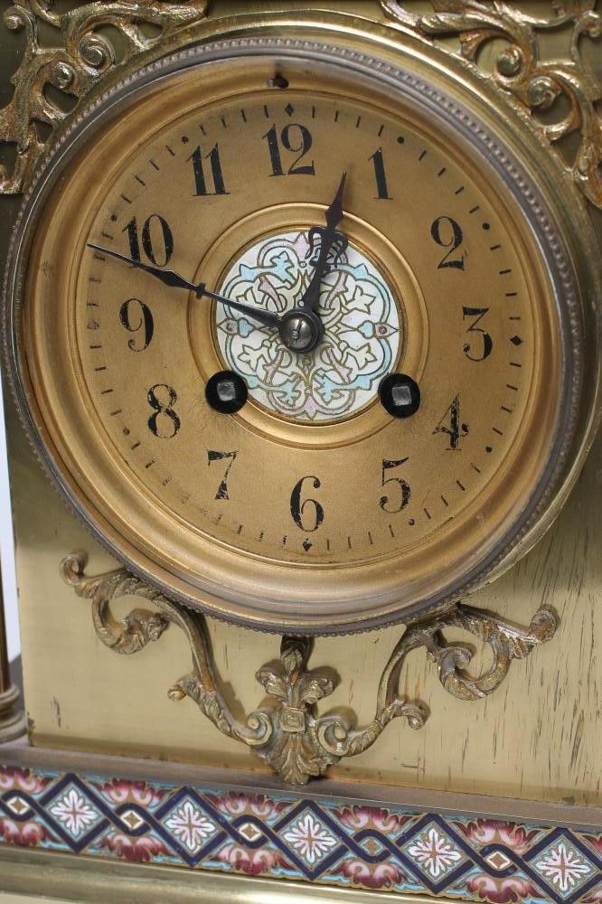 A FRENCH GILT BRASS AND CHAMPLEVE ENAMEL TABLE CLOCK Image