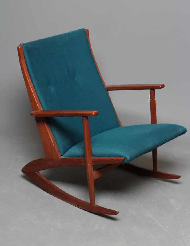 A RETRO TEAK FRAMED ROCKING CHAIR Image