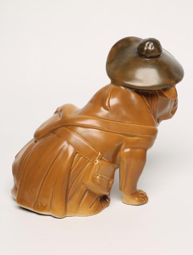 "TAM O'SHANTER" - A Royal Doulton earthenware model of a bulldog wearing a trench coat Image