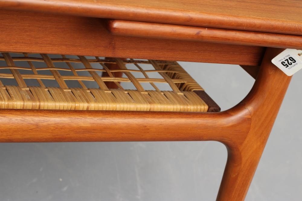 A RETRO MID CENTURY TEAK COFFEE TABLE of oblong form with sliding end extensions Image