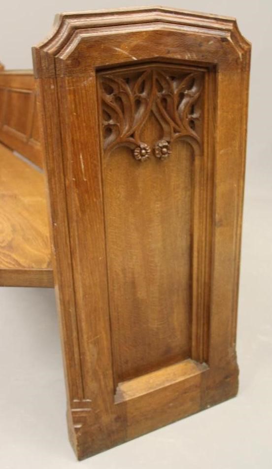 AN OAK CHURCH PEW by Robert Thompson to match the previous lot (Est. plus 21% premium inc. VAT) Image