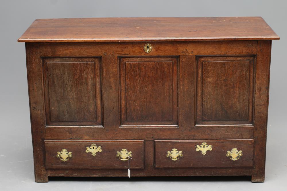 AN OAK PANELLED CHEST Image