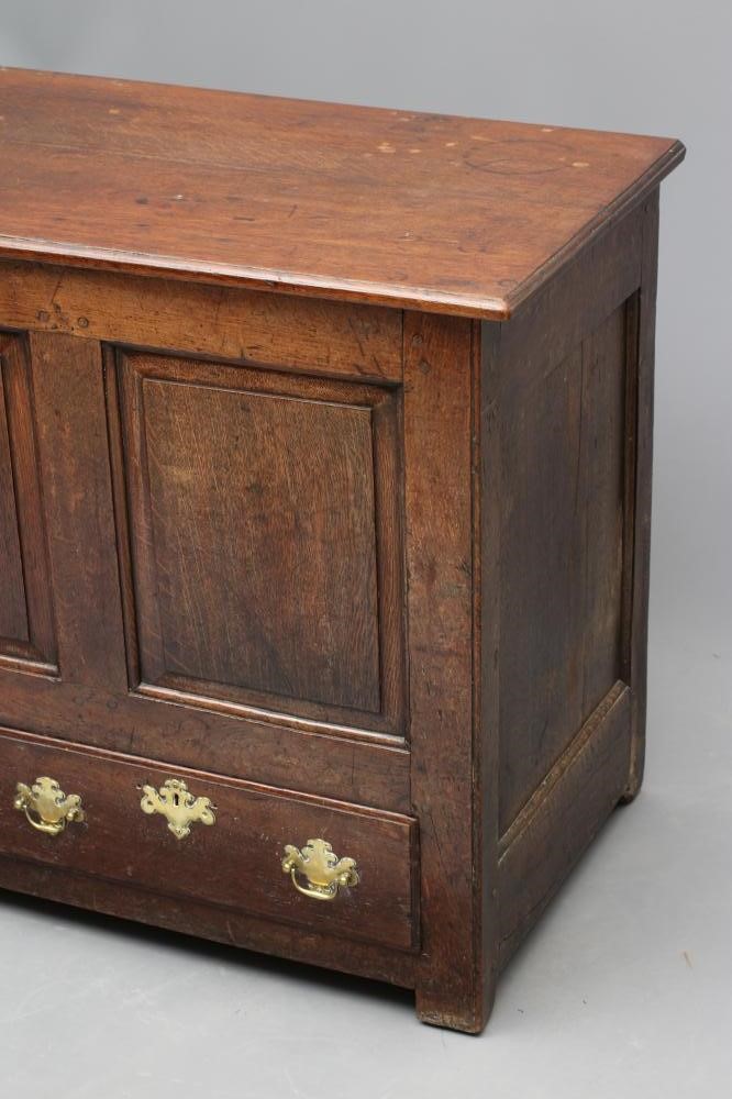 AN OAK PANELLED CHEST Image