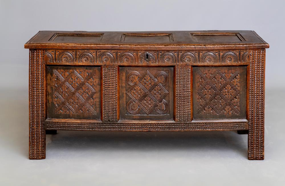 AN OAK PANELLED COFFER Image