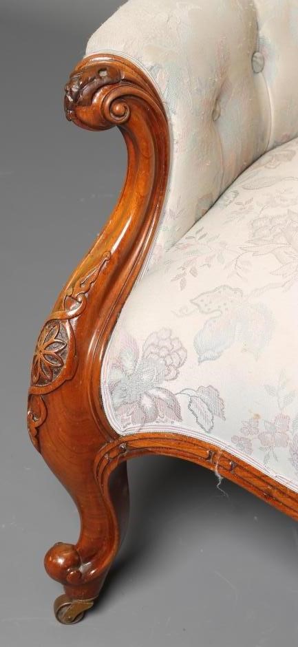 A VICTORIAN WALNUT FRAMED SALON ARMCHAIR of spoon back form button upholstered in an ivory floral Image