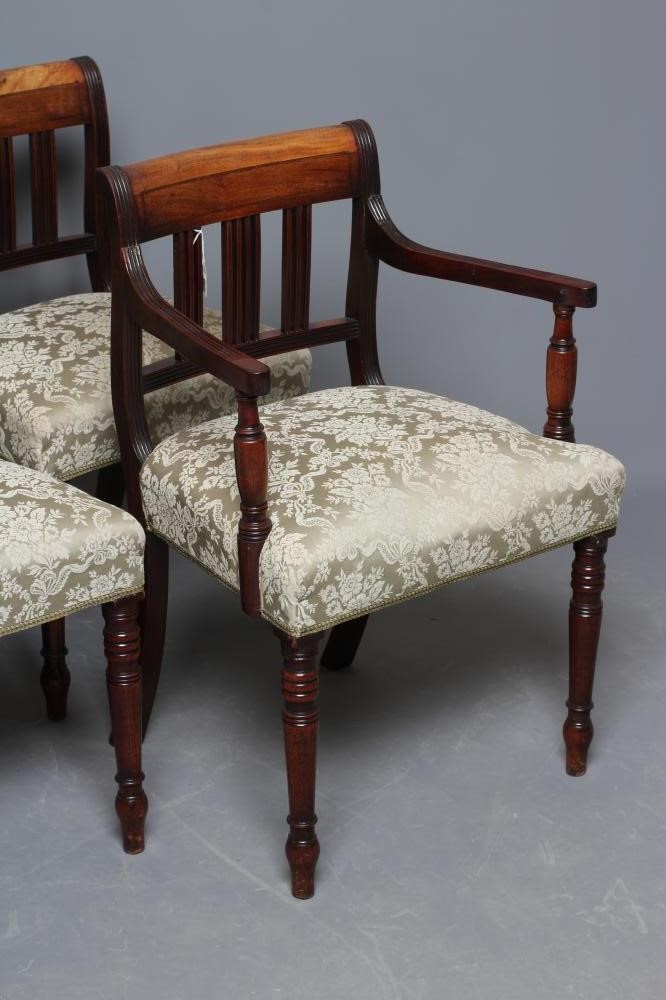 A SET OF FOUR GEORGE IV MAHOGANY DINING CHAIRS including two elbow chairs upholstered in pale green Image