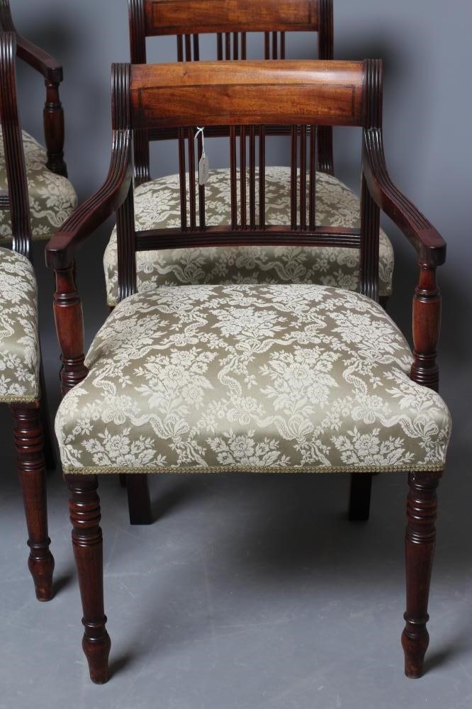 A SET OF FOUR GEORGE IV MAHOGANY DINING CHAIRS including two elbow chairs upholstered in pale green Image