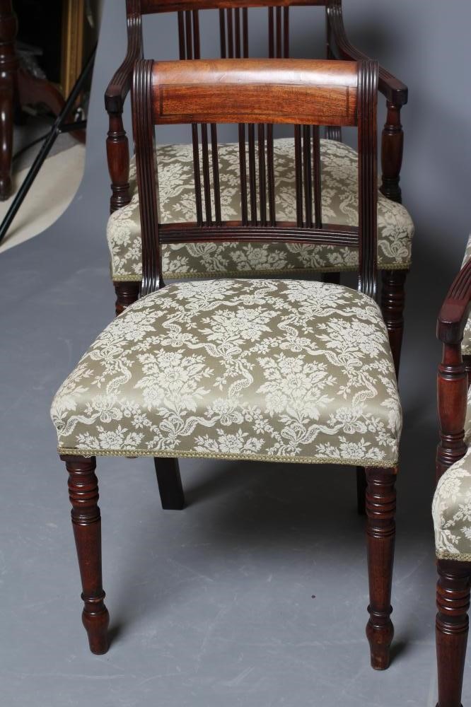 A SET OF FOUR GEORGE IV MAHOGANY DINING CHAIRS including two elbow chairs upholstered in pale green Image