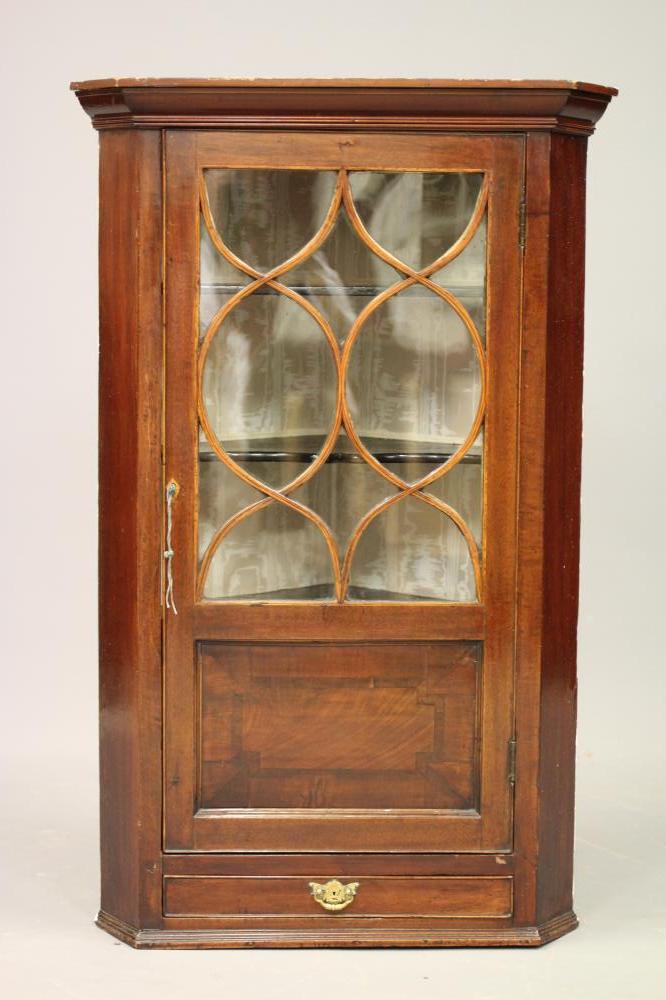 A LATE GEORGIAN MAHOGANY CORNER CUPBOARD Image