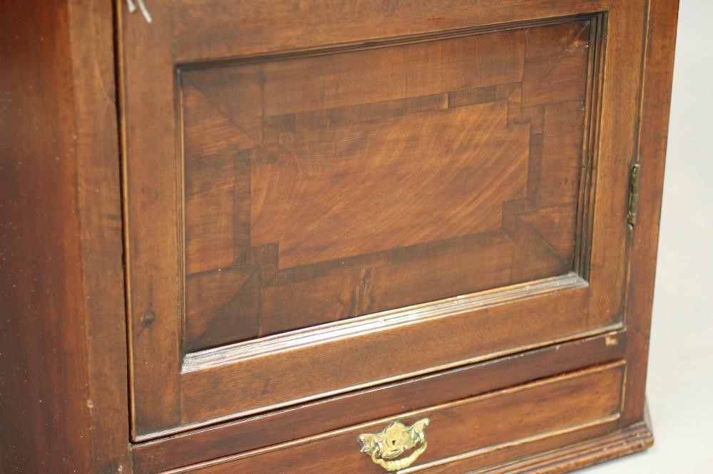 A LATE GEORGIAN MAHOGANY CORNER CUPBOARD Image