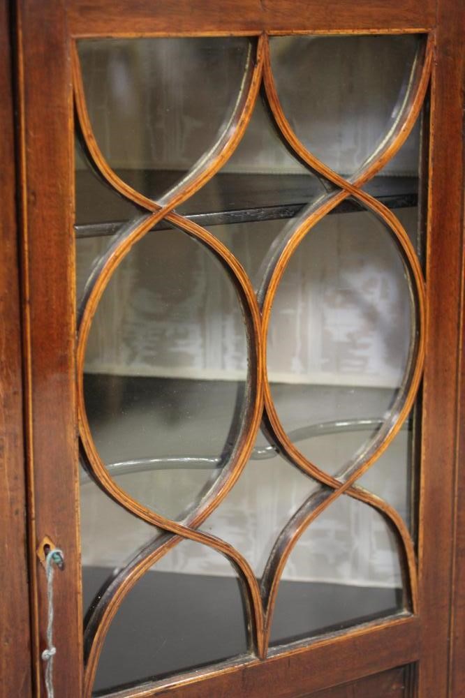 A LATE GEORGIAN MAHOGANY CORNER CUPBOARD Image