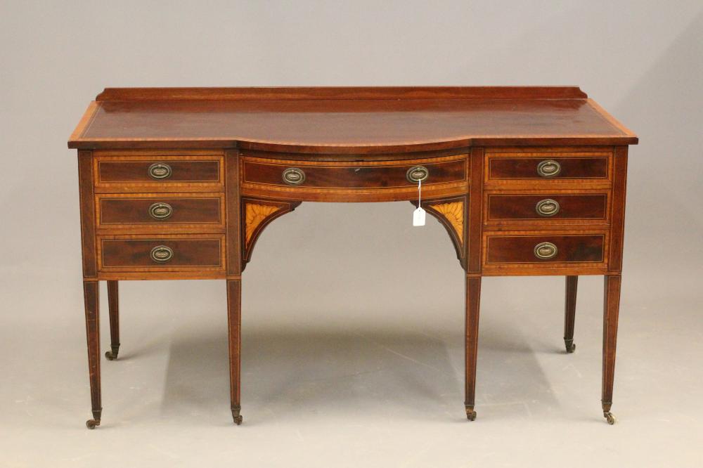 AN EDWARDIAN MAHOGANY AND SATINWOOD BANDED DESK with bowed centre section and stringing Image