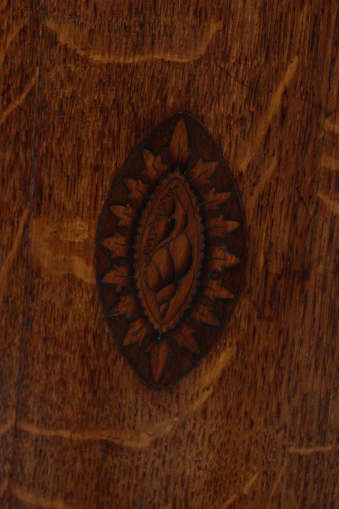 A GEORGIAN OAK AND MAHOGANY BANDED CORNER CUPBOARD Image