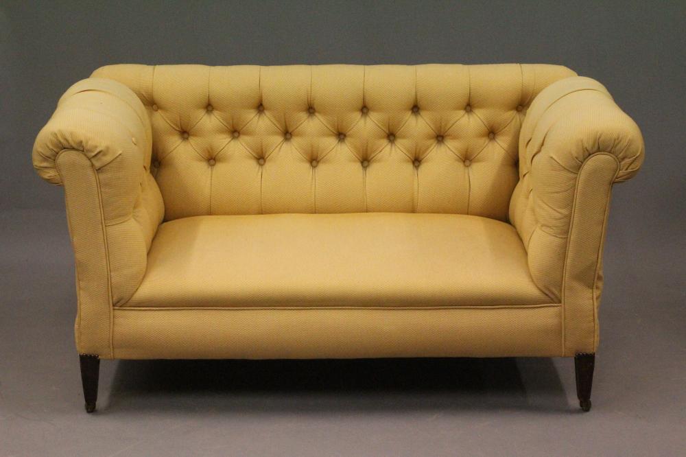 A LATE VICTORIAN MAHOGANY FRAMED DROP END SOFA of Chesterfield type Image