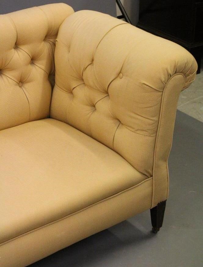 A LATE VICTORIAN MAHOGANY FRAMED DROP END SOFA of Chesterfield type Image
